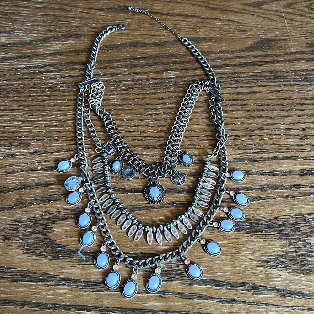 Multi-strand necklace with brass and stone details